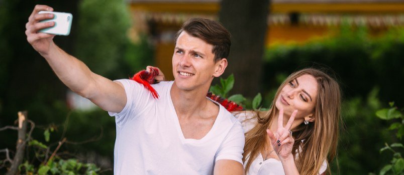 a young couple taking a selfie