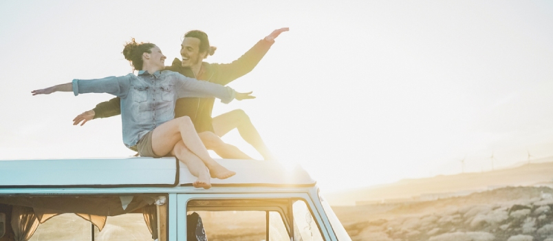 Man and woman enjoying a weekend together on a caravan