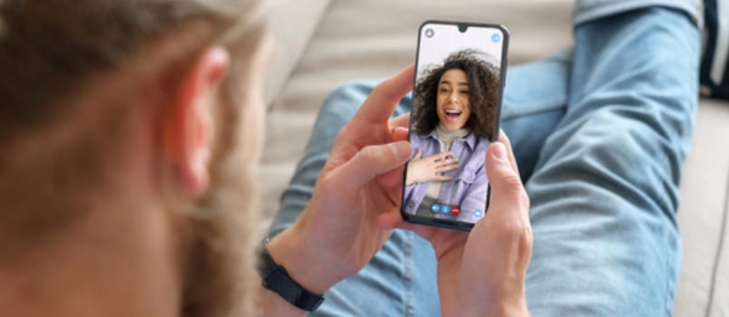 couple on a video call with eavh other where the girl is surprised