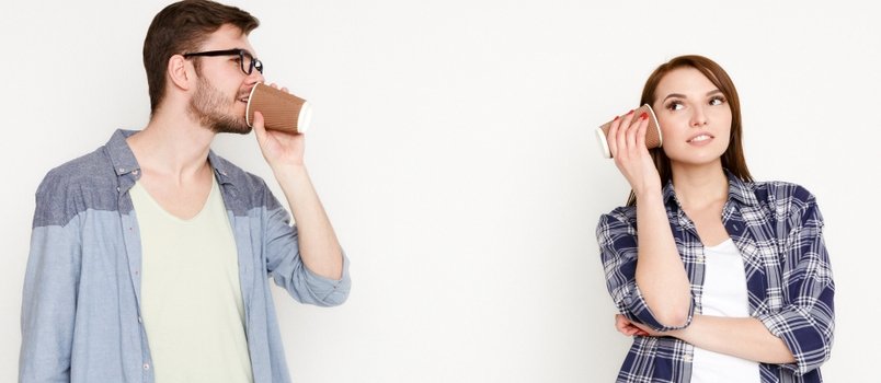 Couple talking using old technology
