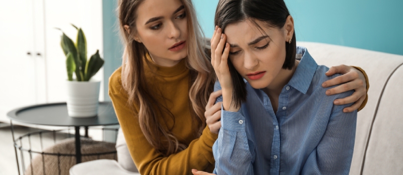 friend consoling her sad friend