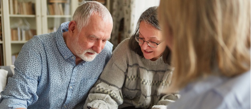 Senior couple signing power of attorney