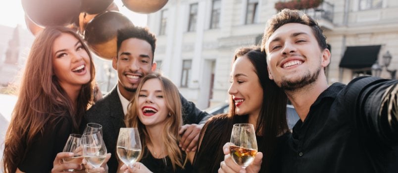 friends celebrating with drinks