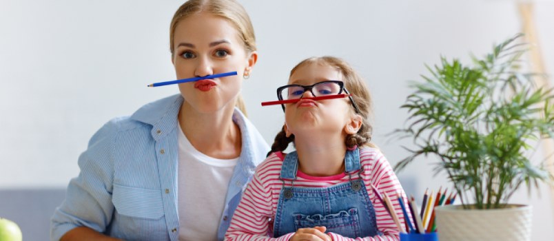 Woman and child making funny faces