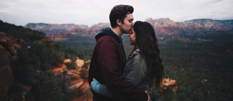 Couple kissing on mountain 