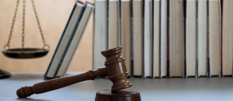 Justice Legal And Jurisprudence Concept. Law Books On Lawyer Desk At Law Firm.