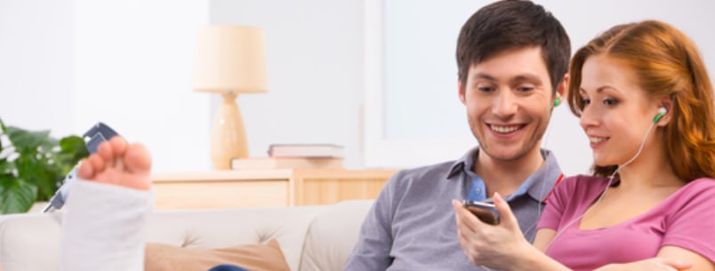 couple looking something funny on the phone