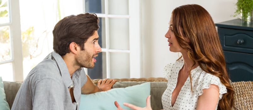 White man and woman talking seriously