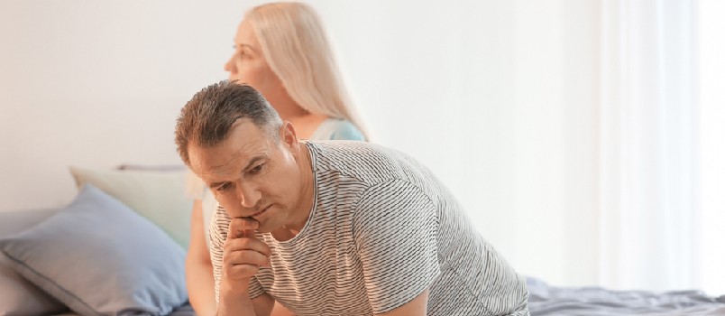 Senior Couple With Problem in Relationship on Bed