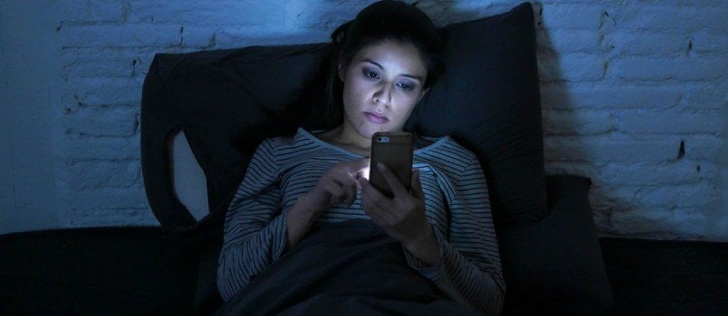 Alone Beautiful Women Using Mobile Phone in the Night