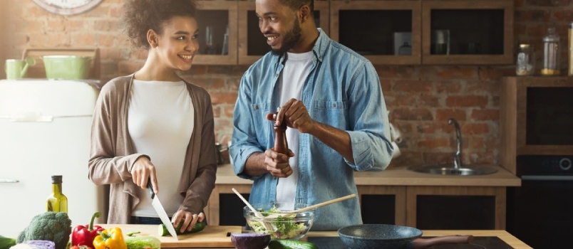 Black couple cooking together