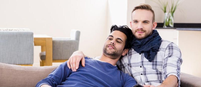 gay couple sitting on the sofa together