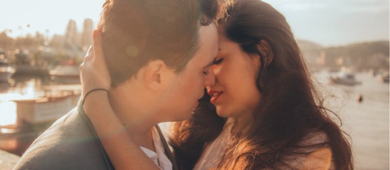 Man And Woman Kissing Beside Bay