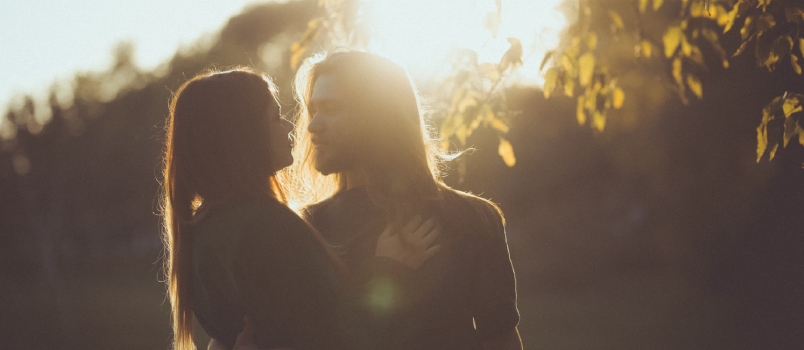 Falling in love with someone that’s not committed Man With Long Hair Holding A Girl By Her Waist Outdoors