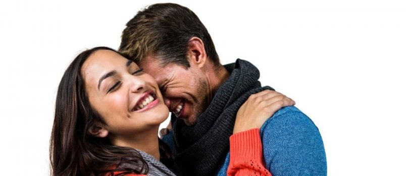 Happy couple in love hugging each other