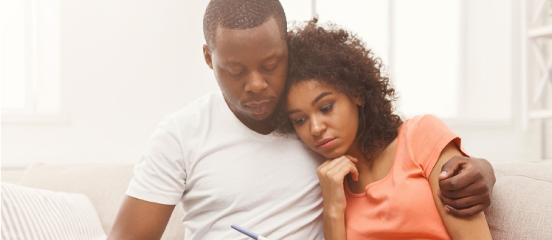 Make sure they also know about the problem Sad African-american Couple After Negative Pregnancy Test Result
