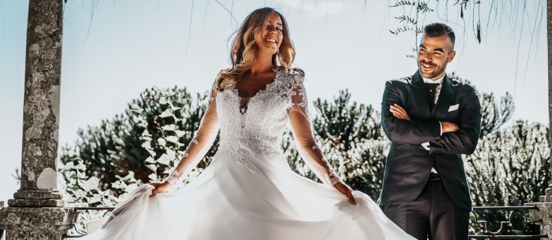 Nail down your wedding style Woman Wearing White Dress Beside Man Wearing Formal Suit Under Wooden Roof During Daytime