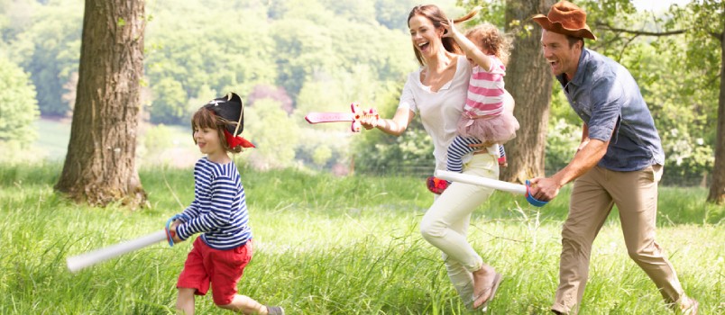 Parents Playing Exciting Adventure Game With Children