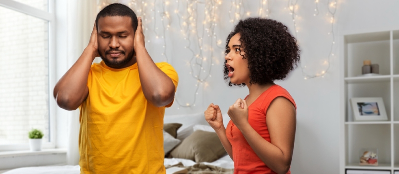 Silent treatment versus shouting matches Unhappy African American Couple Having Argument Over Home Bedroom
