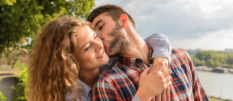 Man Kissing A Beautiful Woman With Wonderful Nature