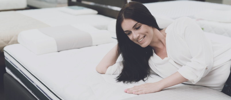 Mattress Women Lay Down On The Mattress And Examining It