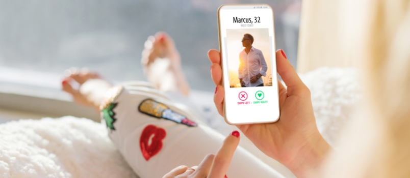 Woman Using Dating App On Mobile Phone