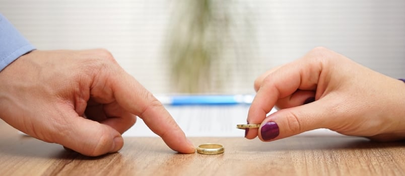 Social media after divorce Man And Women Hand Exchanging Ring For Divorcea