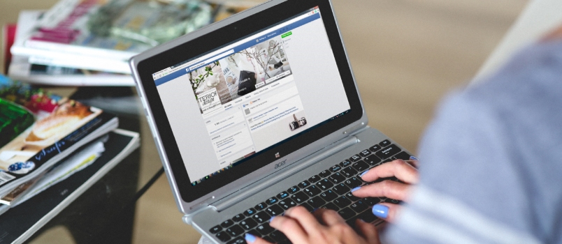 Social media during divorce Women Using Social Media On Laptop Front View Facebook Page