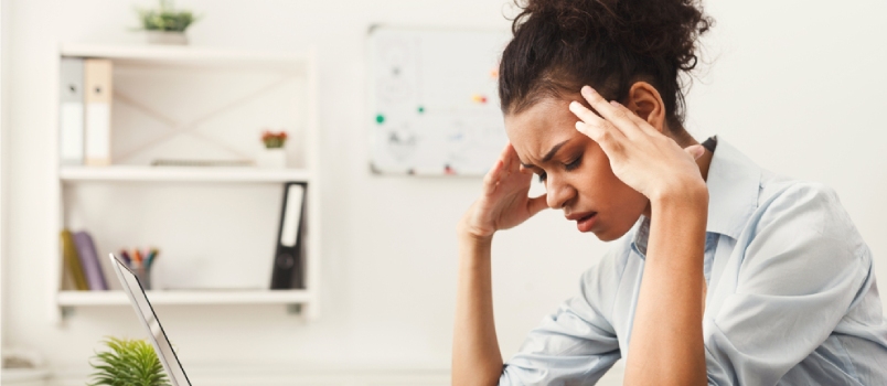 Stress, survival, and emotions Tired African-american Business Woman With Headache At Office