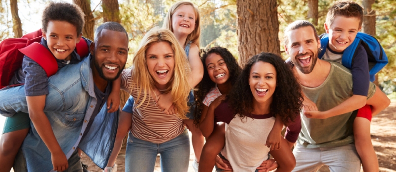 Portrait of Family With Friends on Hiking Adventure in Forest