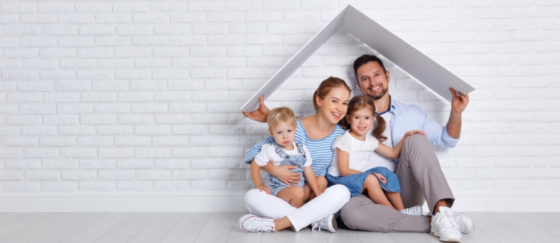 Concept Housing A Young Family Mother Father And Children In A New Home