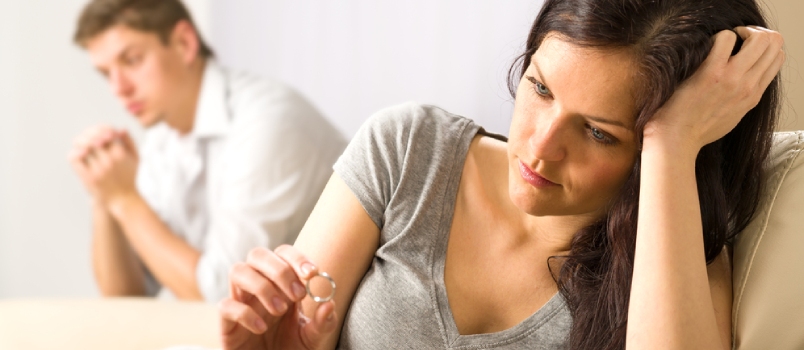 Sad Wife Looking At Her Ring After Fight With Husband