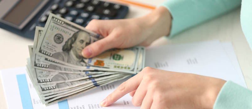 closeup of cash in hands of a woman
