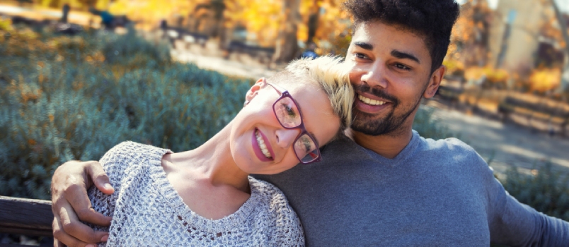 Outdoor Portrait Of Romantic And Happy Mixed Race Young Couple In Park