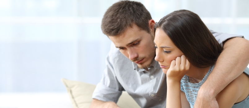 Upset Couple Sitting Together
