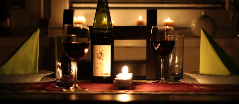 Wine Glass Filled With Wine Beside Bottle On Table