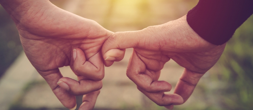 Happy Couple Holding Hands Together As Forever Love