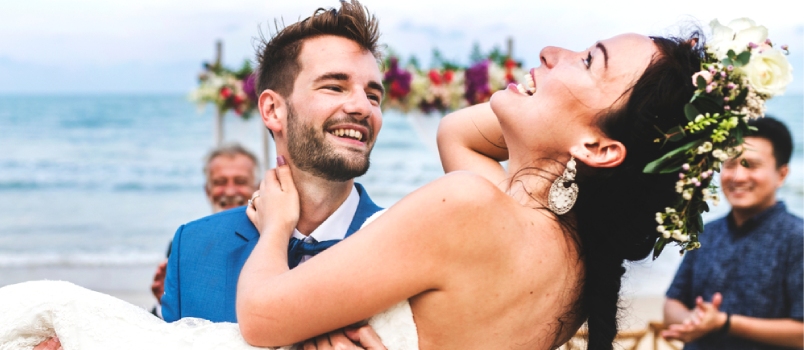 Cheerful Newlyweds At Beach Wedding Ceremony