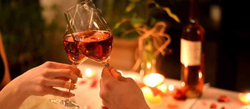 Men And Women Hands With The Glass Of Wine In Cafe With Romantic Dinner Table