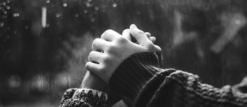 Couple Holding Hands Each Other In Front Of Window Glass In The Winter Rain Climate- Love Concept