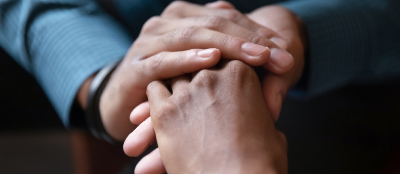 Close Up Of Young Couple Hold Hands Talking Sharing Secrets Showing Love And Care
