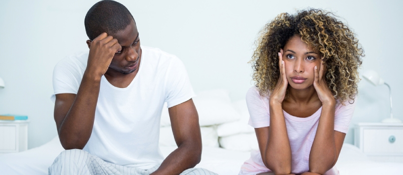 Upset Couple Ignoring Each Other After Fight On Bed In Bedroom