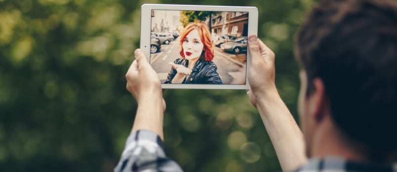 Young Couple In A Long Distance Relationship Chatting Over A Video Call, By Using A Tablet.