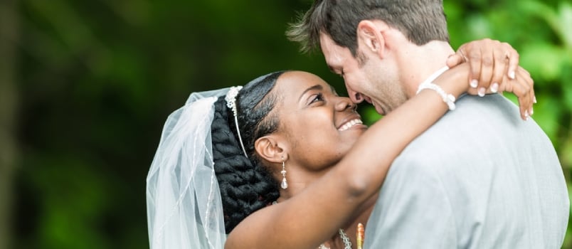 Bride And Groom Embrace And Looking At Each Other