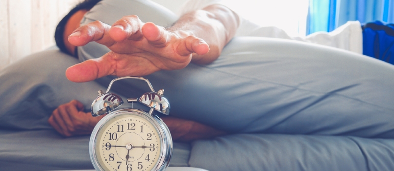 Hand Turns Off The Alarm Clock Waking Up At Morning