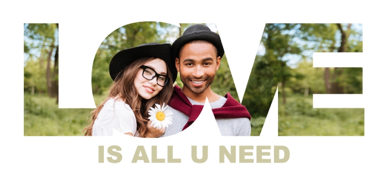 Close Up Portrait Of A Young Smiling Multiracial Couple In Love Looking At Camera Outdoors, All You Need Is Love Signature