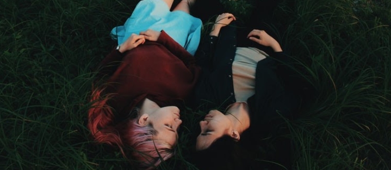 Love Couple Lying Together On Grass At Park