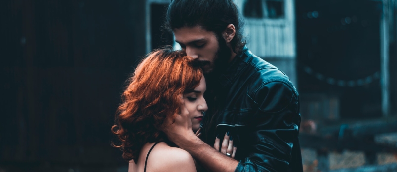Shallow Focus Photography Of Man And Woman Hugging