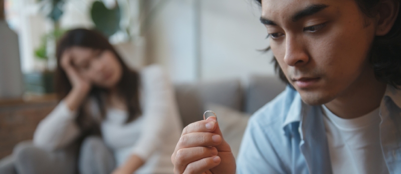 Young Asian Couple Have A Relationship Problem And Thinking About Divorce While Looking Engagement Ring