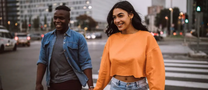 American And Black Lesbian Couple Crossing Road Walk With Holding Hand Together Smiling Relationship Concept